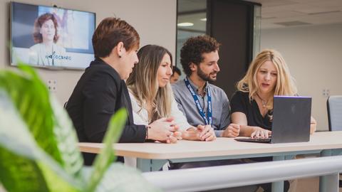 Airbus Crisa employees working together in a common area
