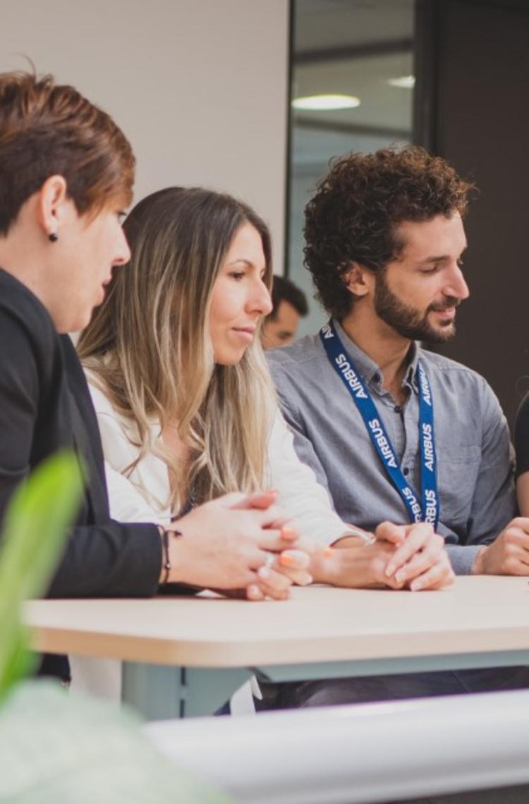 Airbus Crisa employees working together in a common area